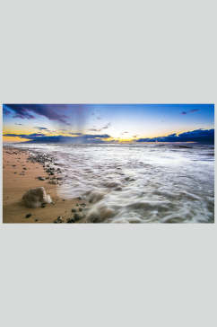 日出的沙滩摄影图片