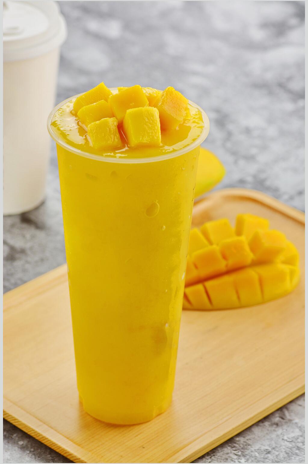 芒果汁美食摄影图