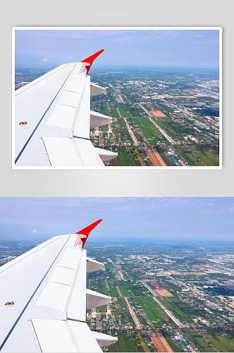 阳光明媚城市客机民航飞机空中摄影