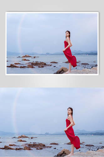 深圳较场尾海边礁石上的红衣少女手拿裙摆高清图片