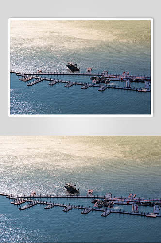 惠州巽寮湾夕阳下大海上的渔船快艇和渔港高清图片