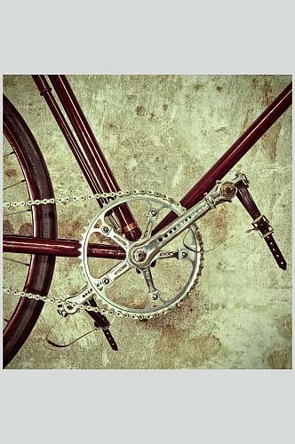老旧自行车踩踏板摄影图片