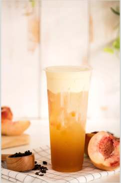 夏日水蜜桃饮品奶茶摄影图