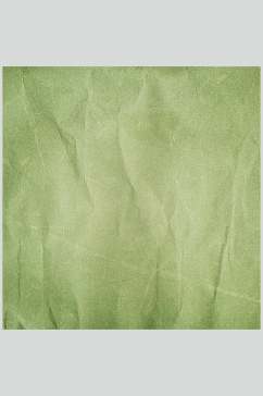 清新绿色褶皱纸张实拍图片