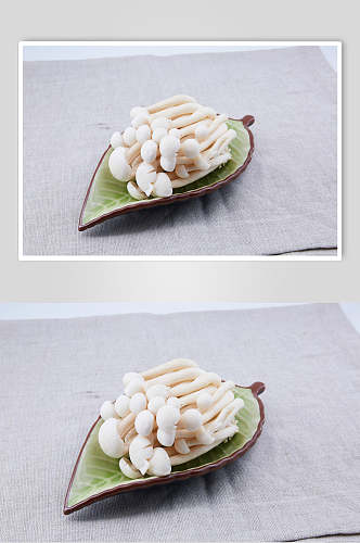 小蘑菇绿叶碟麻辣烫菜摄影图片
