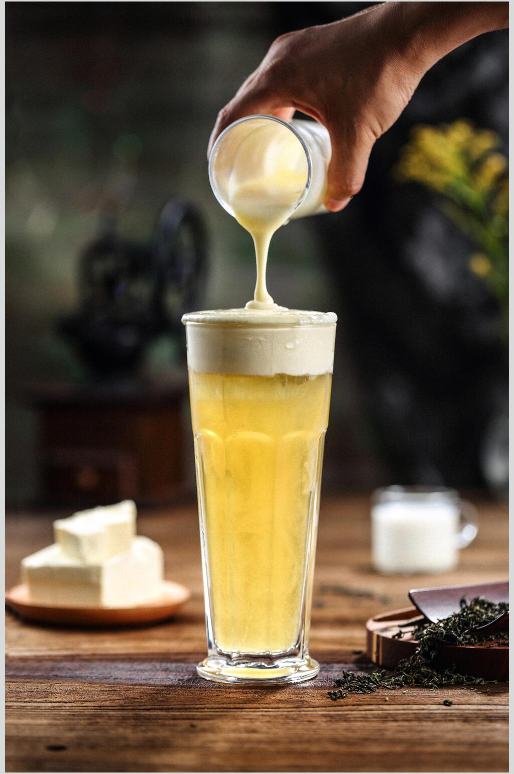 杯子手掌黄色精致果汁奶茶摄影图片素材
