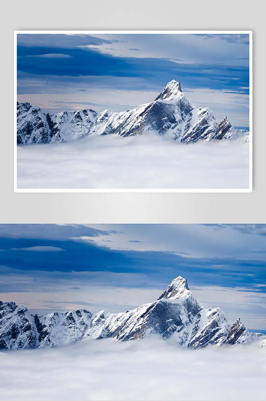 云雾缭绕山巅雪山雪景摄影图片