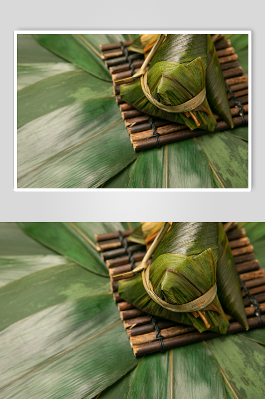 端午节绿色粽叶粽子传统美食摄影图片