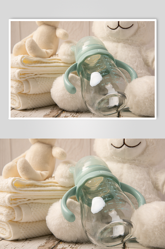 绿色奶瓶玩具熊母婴用品摄影图片