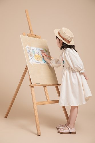 秋季白色碎花连衣裙儿童画画人物摄影图片