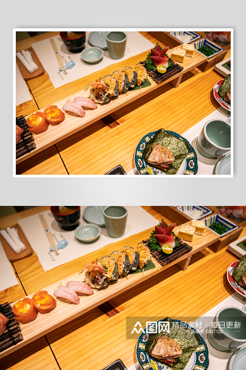 手握富贵卷日料日本料理美食摄影图片素材