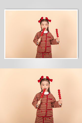 棉袄吃糖葫芦龙年新年小朋友人物摄影图片