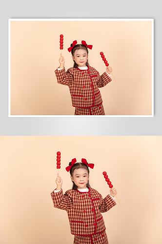 棉袄吃糖葫芦龙年新年小朋友人物摄影图片