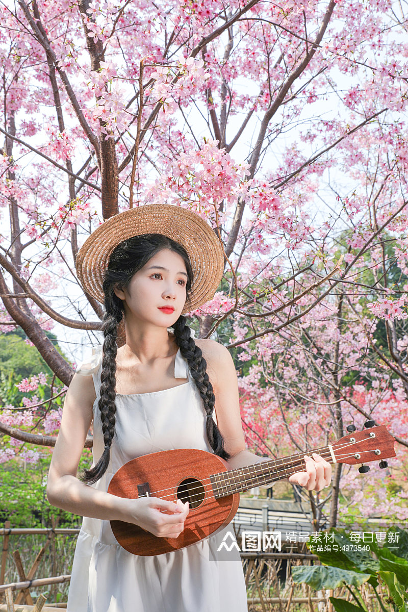 夏日樱花中的白连衣裙少女人物摄影图片素材