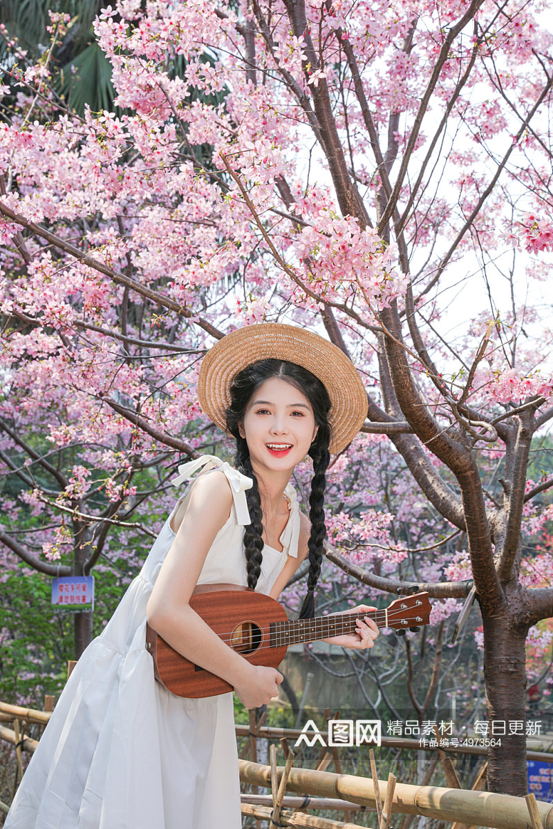 夏日樱花中的白连衣裙少女人物摄影图片素材