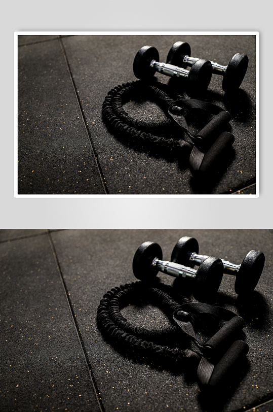 哑铃片举重哑铃健身房锻炼器械摄影图片