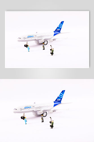 飞机春运微距小人春节物品元素背景摄影图片
