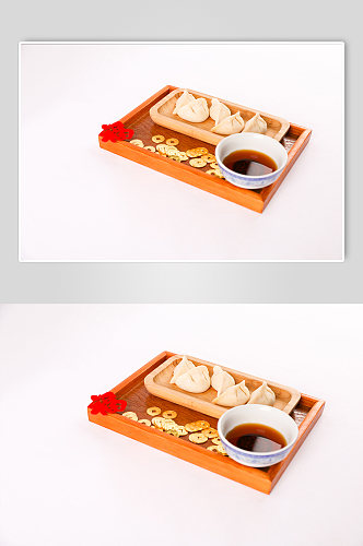 新年饺子蘸醋美食春节物品元素摄影图片