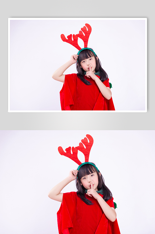 戴着鹿角发夹的可爱圣诞小女孩摄影图