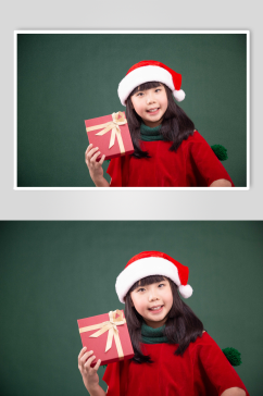 拿着礼物盒的圣诞小女孩摄影图