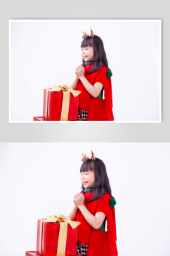 在礼物盒前许愿的圣诞小女孩摄影图