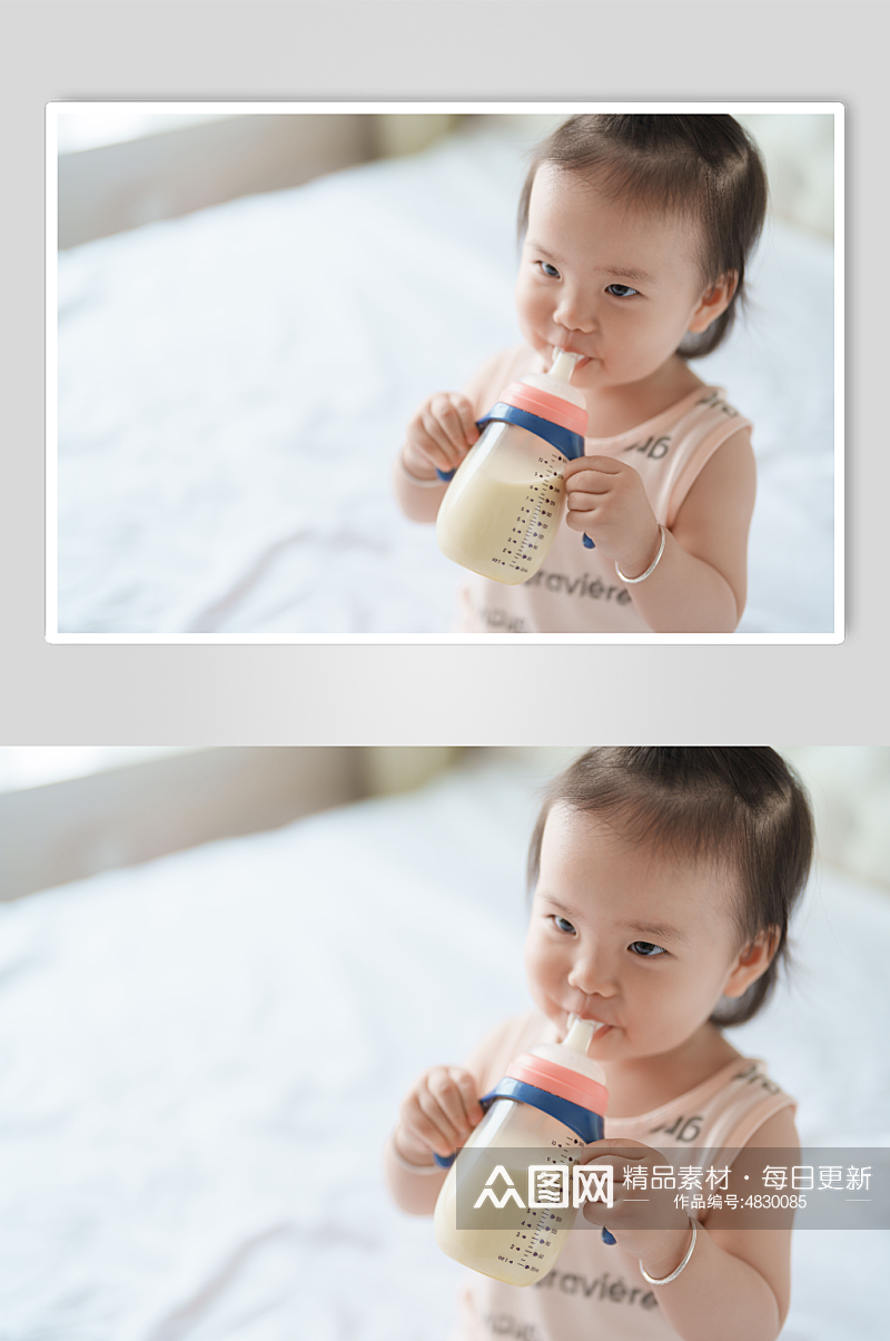 拿着奶瓶喝奶的小宝宝人像摄影图素材