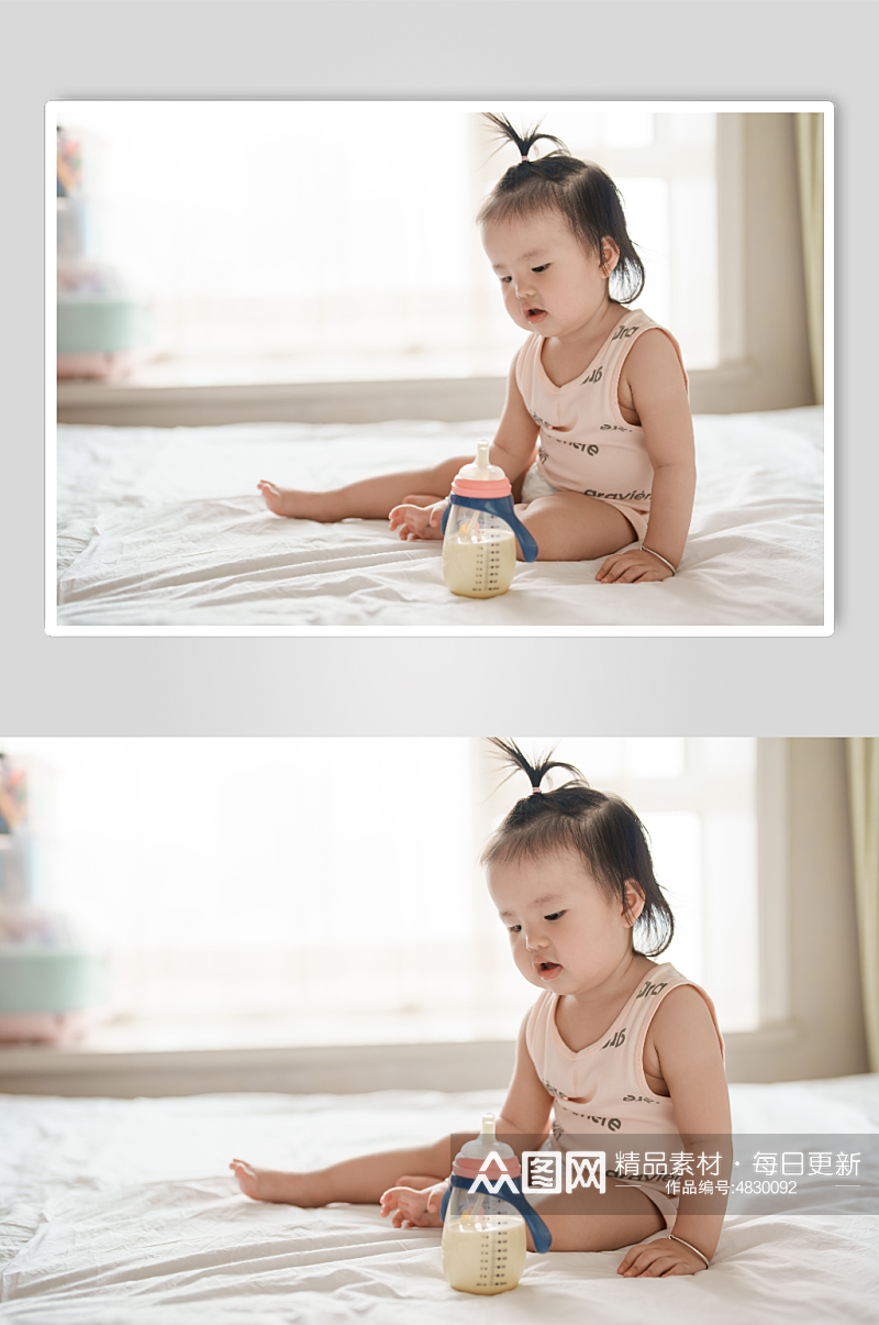 坐在床上喝奶的婴儿人物摄影图素材