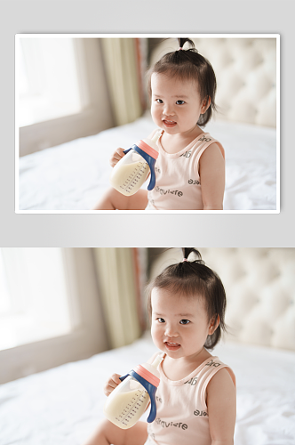 拿着奶瓶的的婴儿人物摄影图
