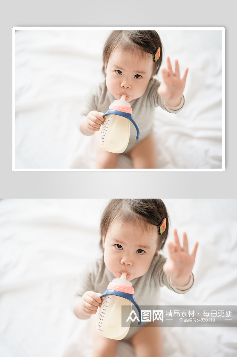 坐在床上喝奶粉的婴儿人物摄影图素材
