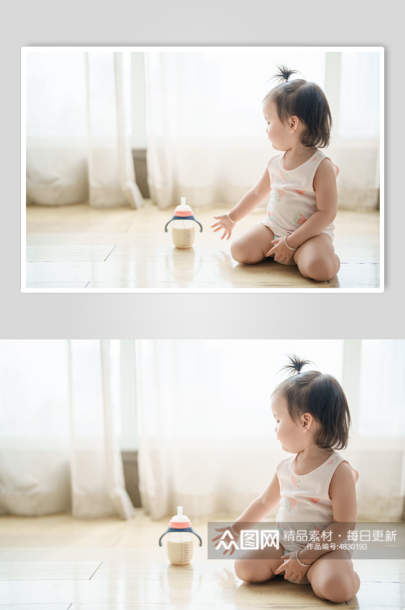 拿奶瓶玩耍的小宝宝摄影图素材