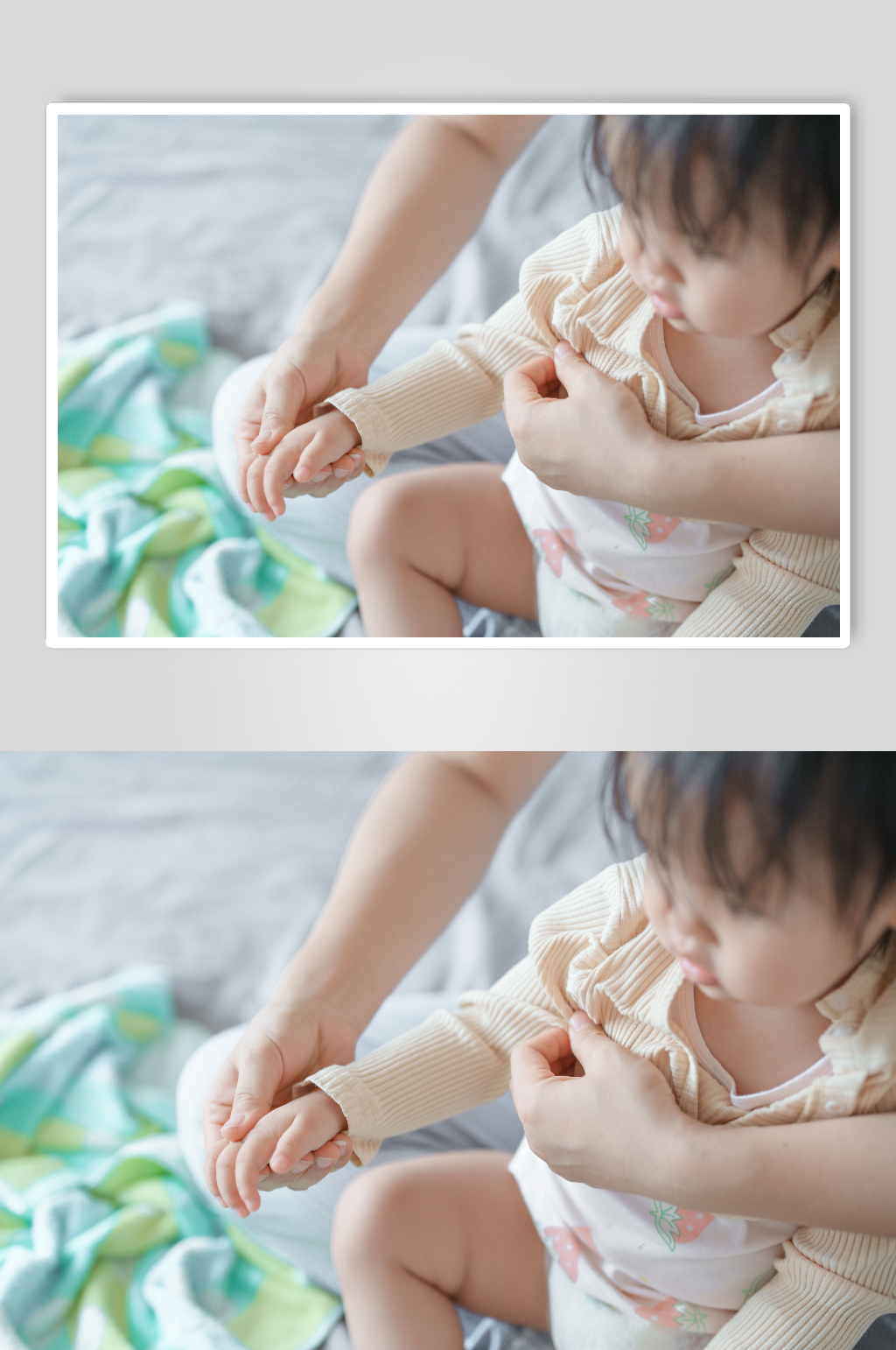 温馨婴幼儿穿衣服摄影图片素材