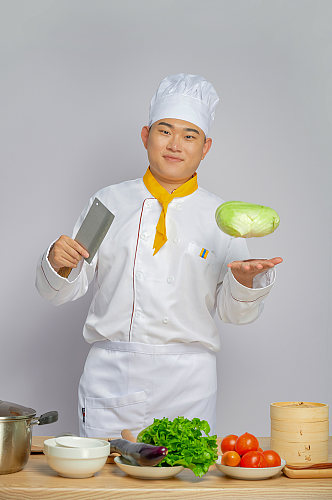 餐饮商业厨师服人物摄影手持蔬菜菜刀图片