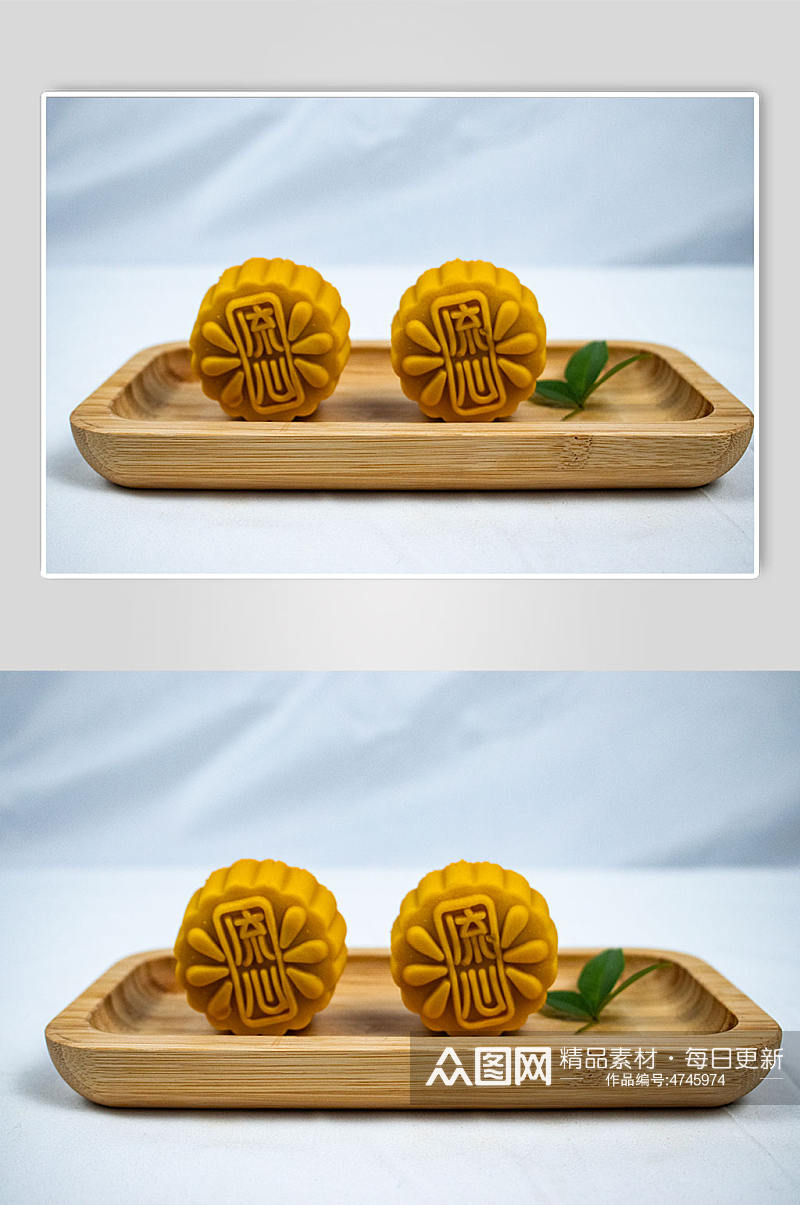 中秋节流心月饼美食树叶摄影图片素材