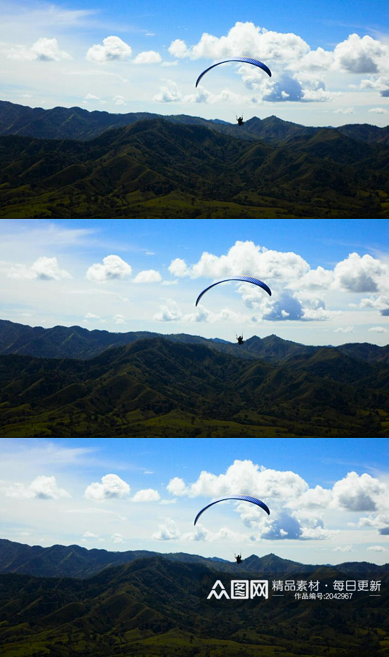 飞越山脉的滑翔伞运动员实拍素材