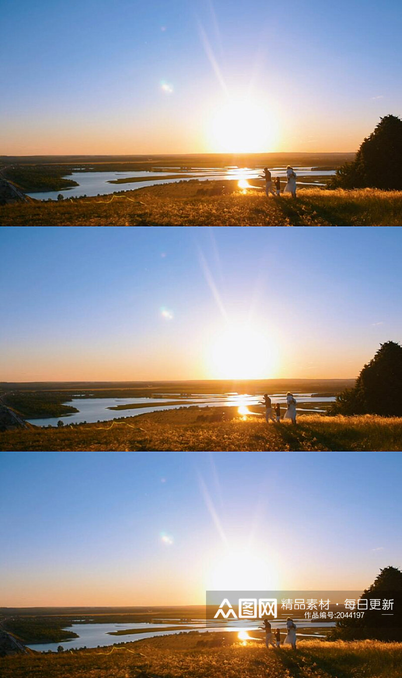 夕阳下一组家庭在草原放风筝美丽景色实拍素材