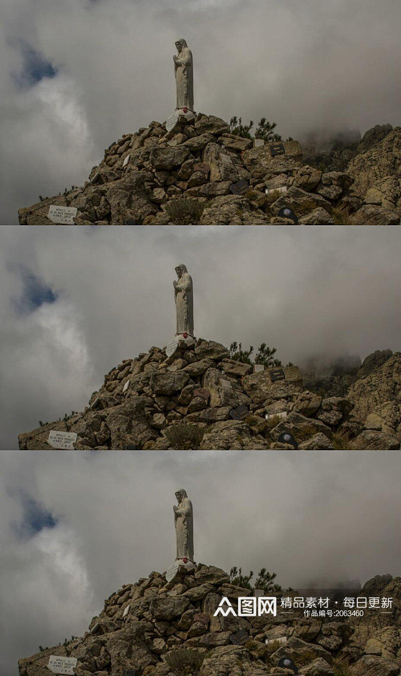 延时摄影岩石山上祈祷之手的雕像实拍素材