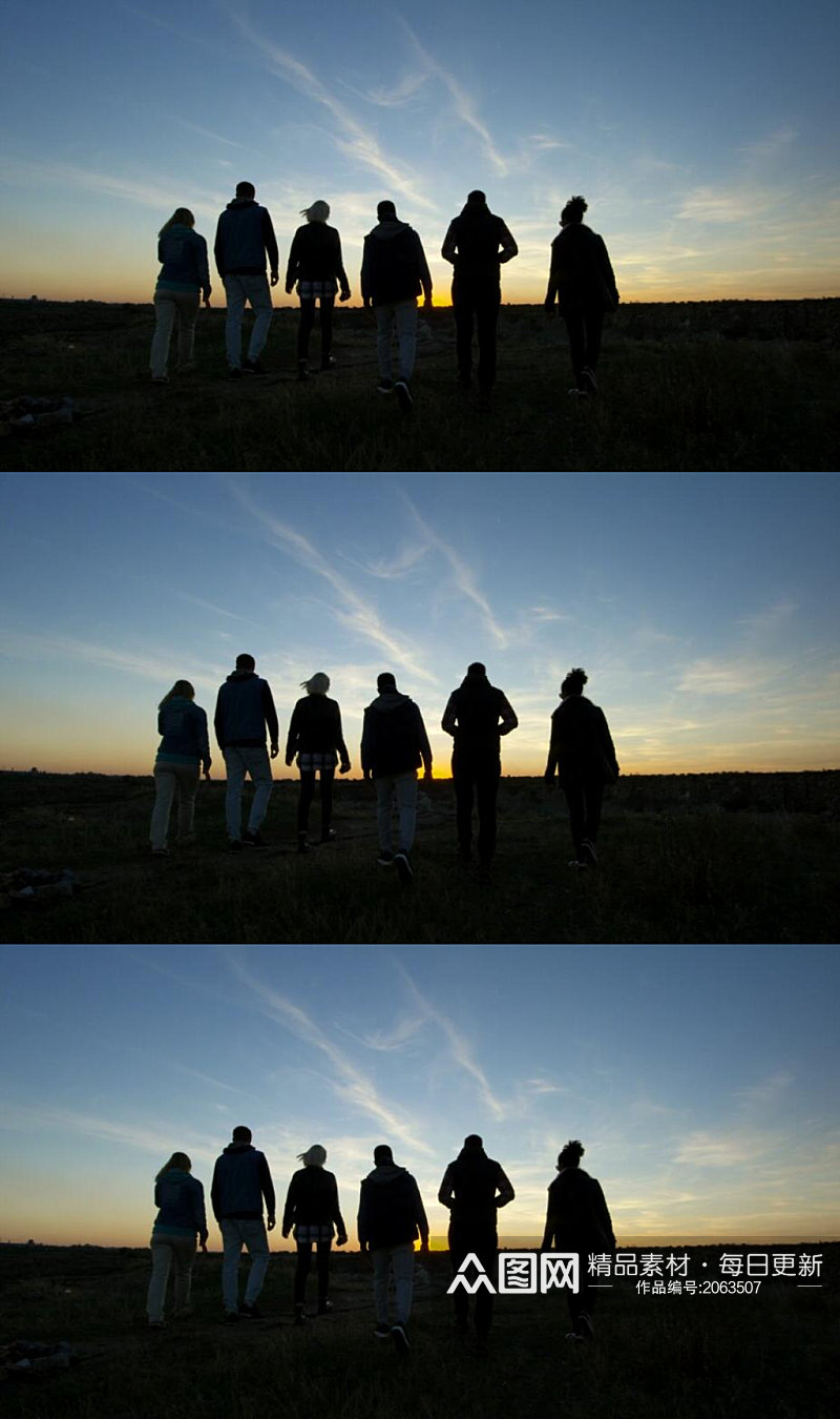 一群朋友看夕阳落日美景实拍视频素材