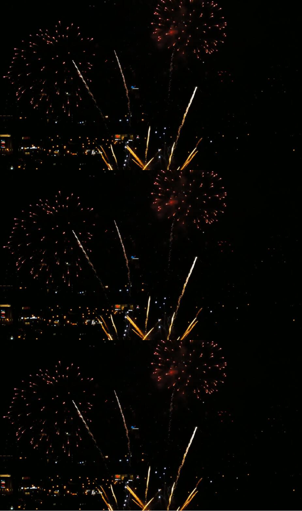 城市夜空中放烟花庆祝节日实拍视频素材
