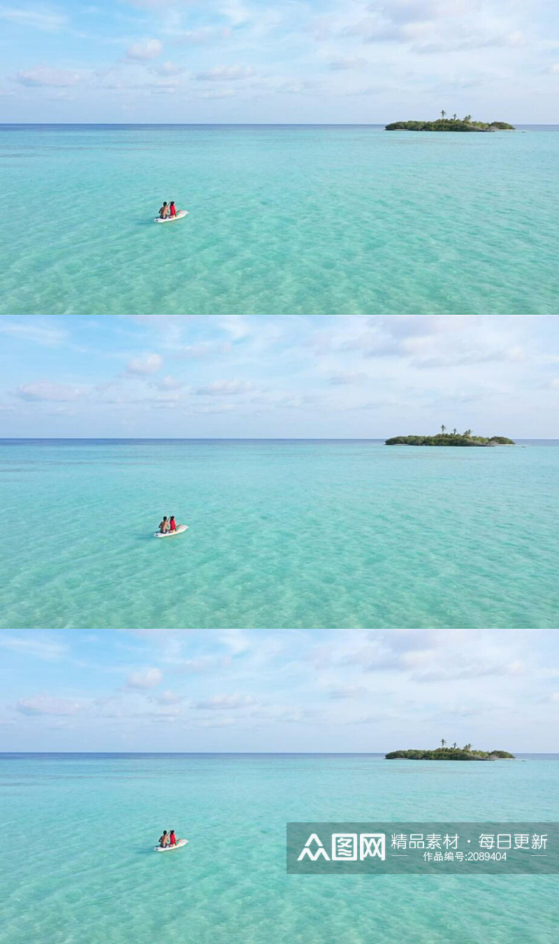 碧绿大海里划着小艇驶向小岛美景实拍素材