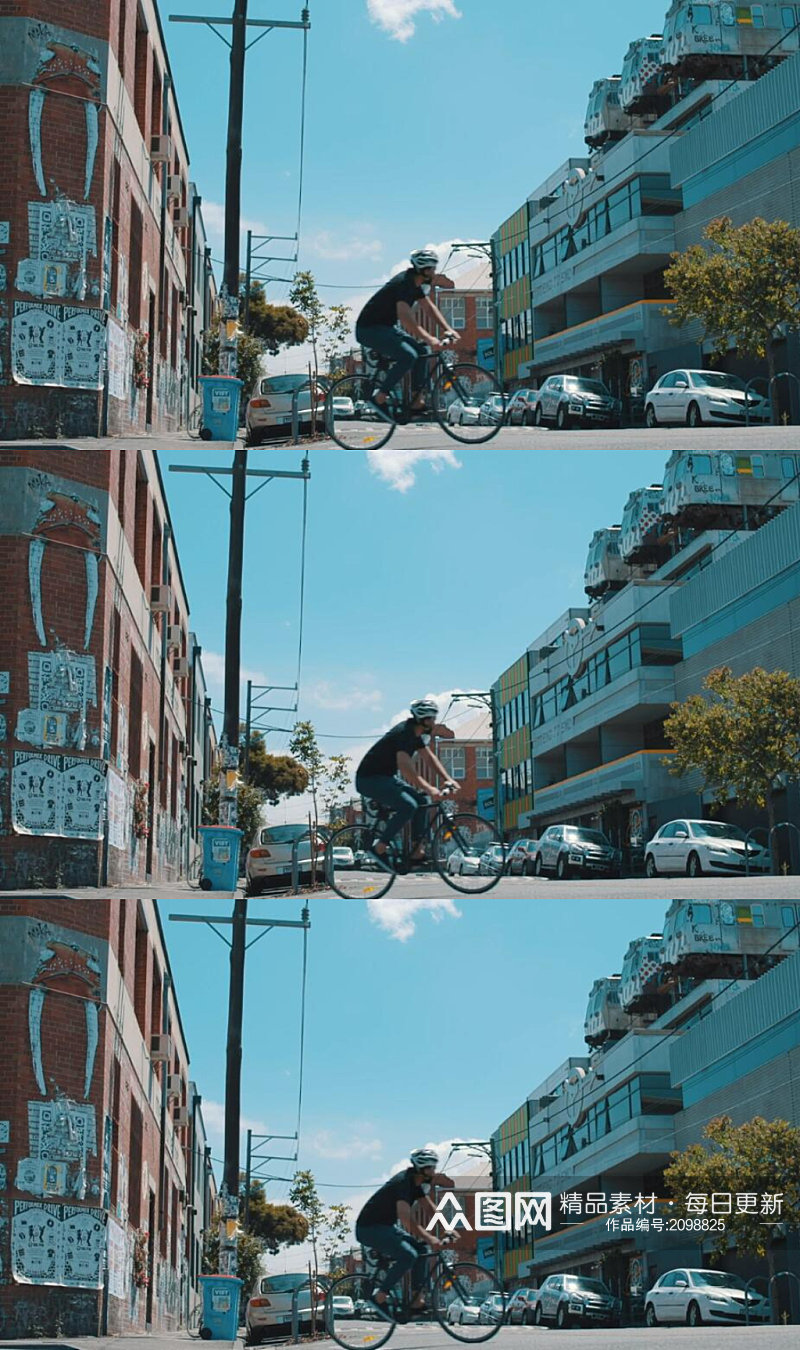 一个年轻男子在城市道路上骑自行车实拍素材素材