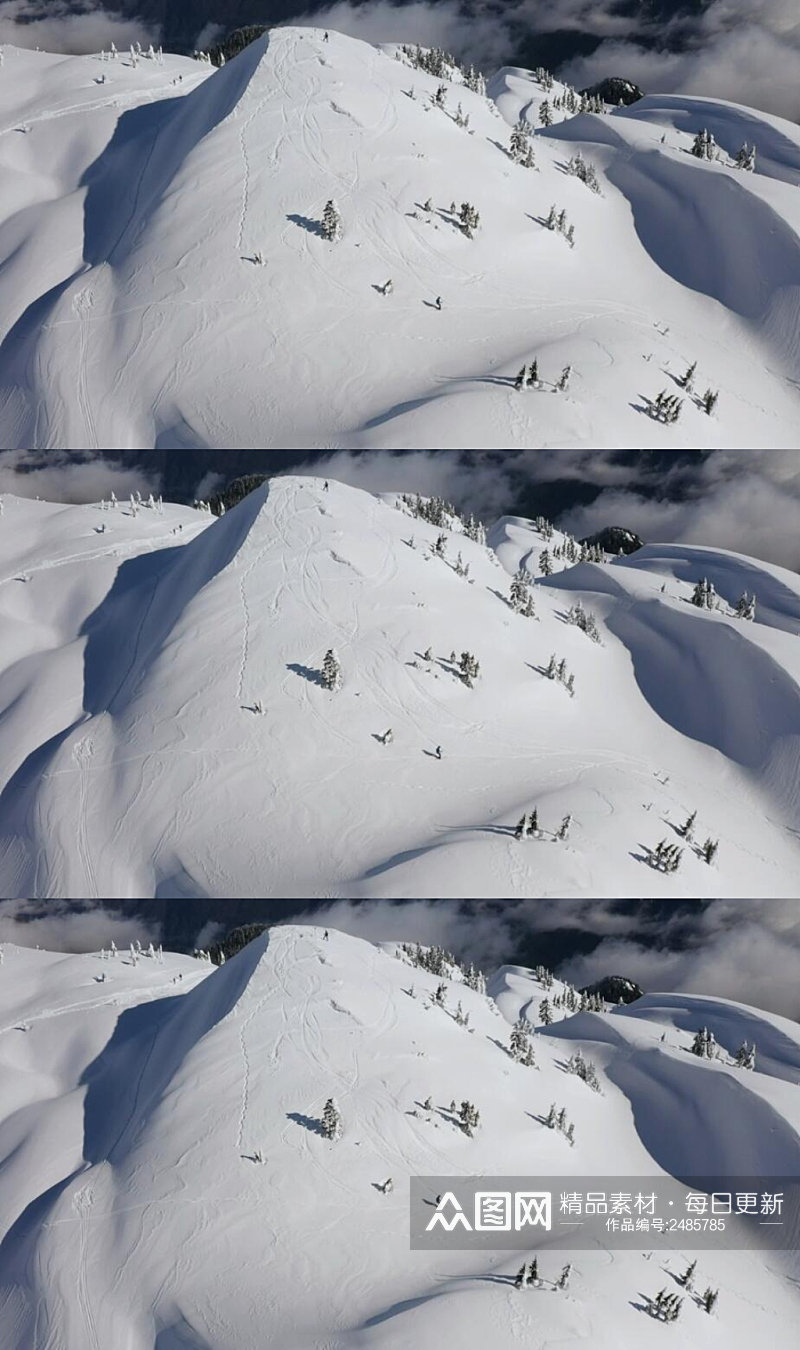航拍冬季雪山山脉上的滑雪运动实拍视频素材