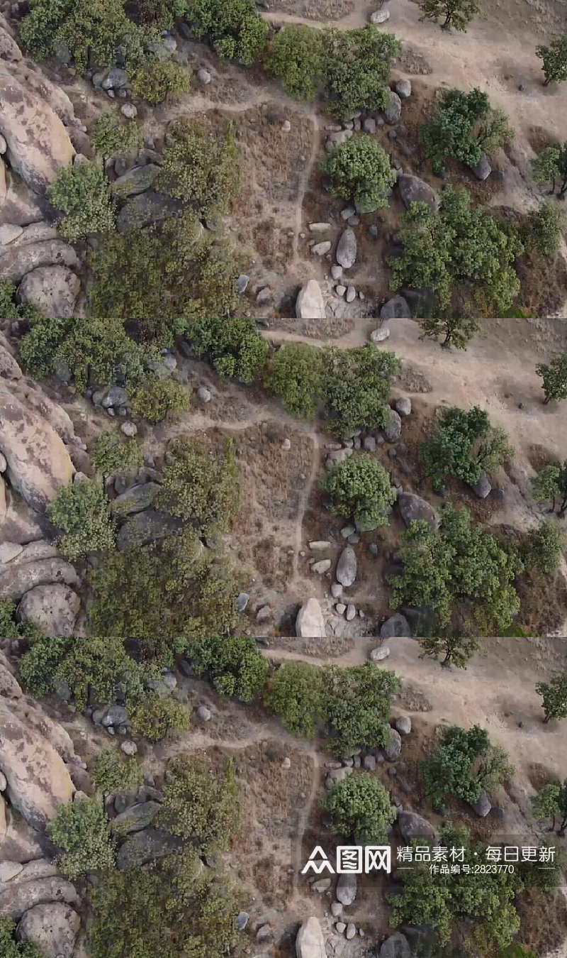 航拍山脚下的岩石树木美景实拍视频素材