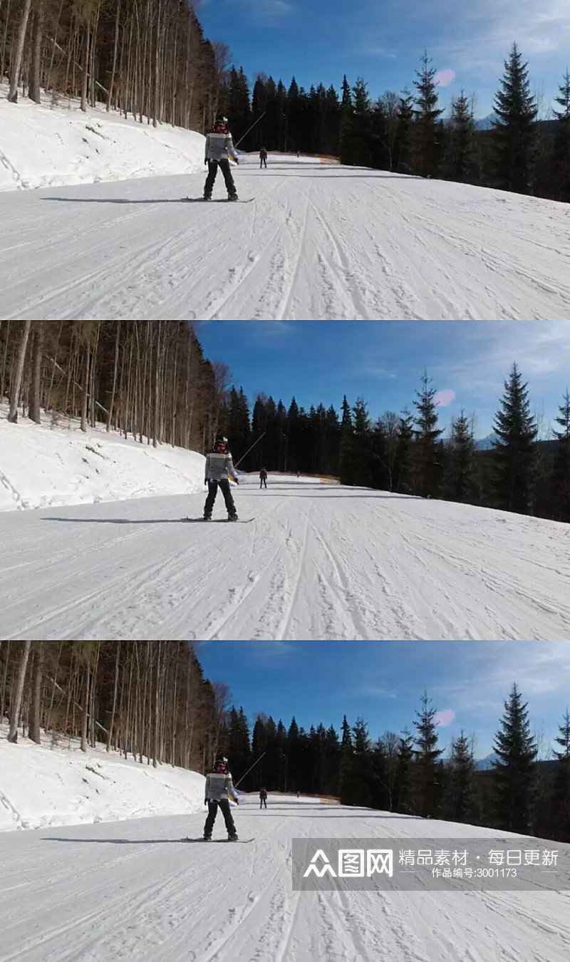 沿着山上的滑雪道滑雪运动实拍视频素材
