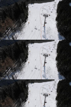 航拍雪山滑雪场游玩美景是实拍视频