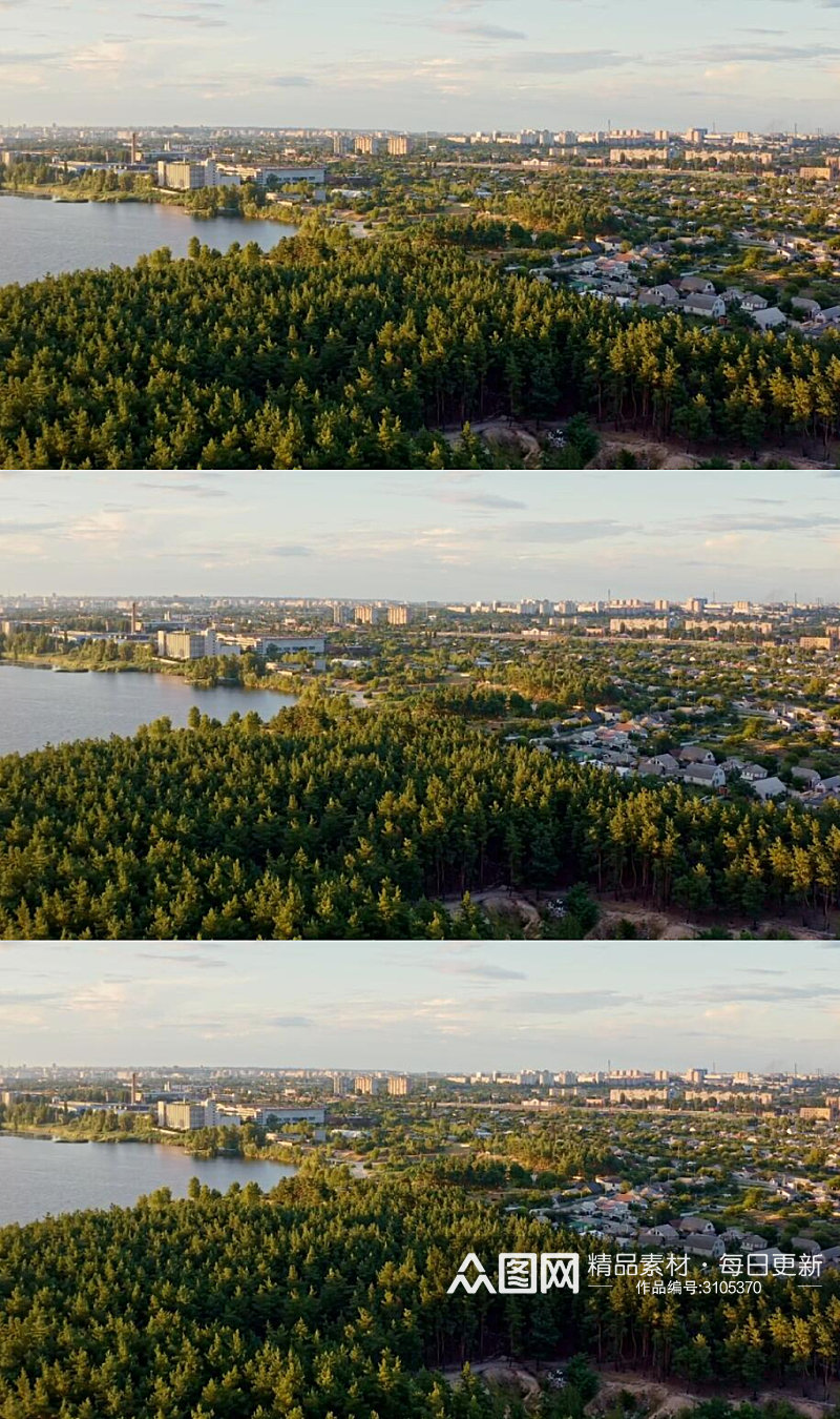 航拍日落夕阳下的森林湖边城市实拍视频素材