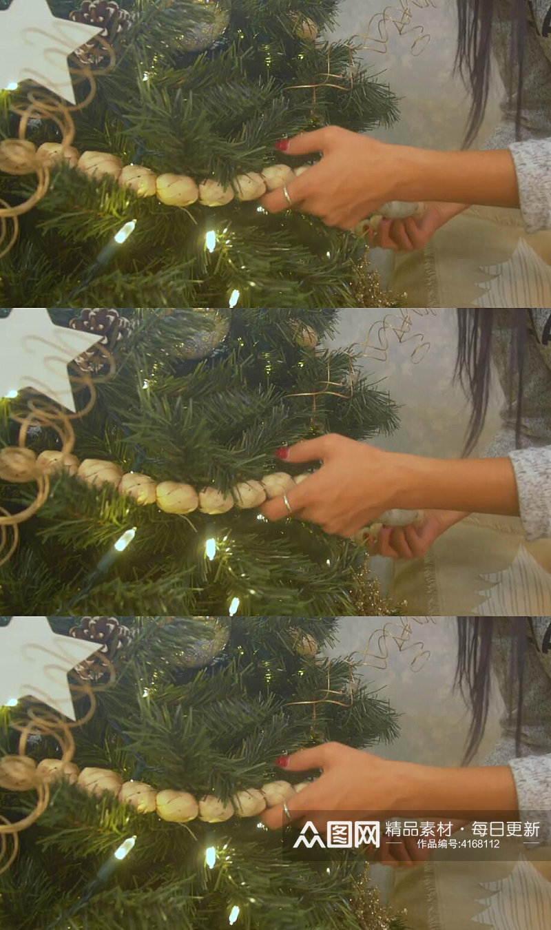 圣诞节女生装饰圣诞树实拍视频素材