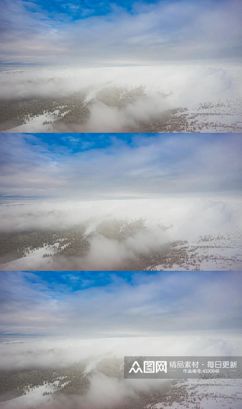 冬季天空云雾弥漫的雪山实拍视频素材