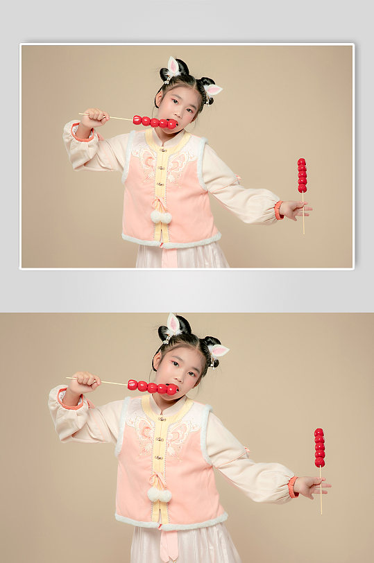 手持糖葫芦小女孩兔年新年汉服儿童摄影图