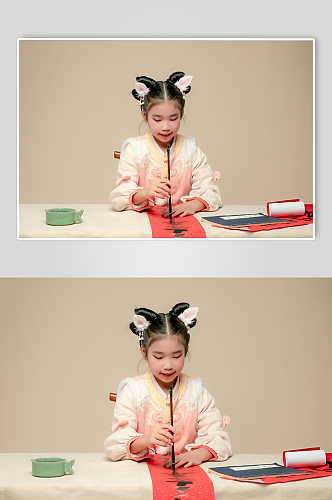 春节写春联小女孩兔年新年汉服儿童摄影图