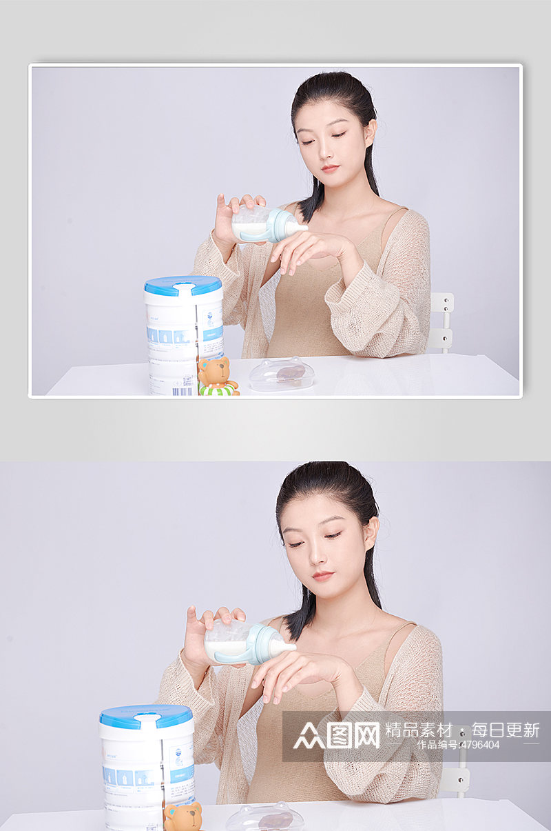 手拿奶瓶冲奶粉饰优雅孕妇人物摄影图素材